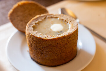 aromatic traditional hot chowder in a bowl of rye bread