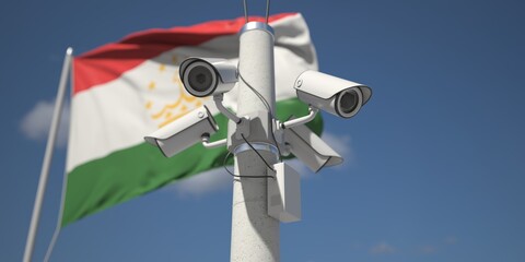 Naklejka na ściany i meble Waving flag of Tajikistan and the security cameras. 3d rendering