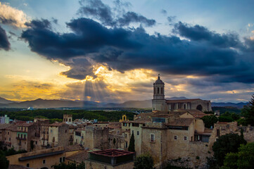 Fototapeta premium Girona, Spain - July 28, 2019: Cityscape of the city of Girona with the famous Girona cathedral at sunset, Catalonia, Spain