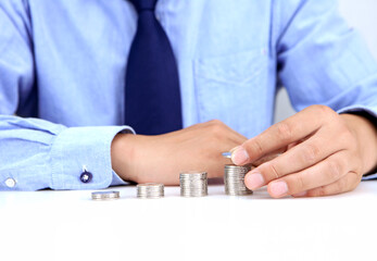 Stacks of silver coins, in an upward trend