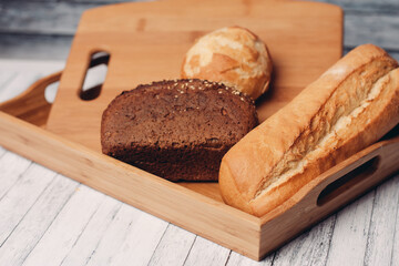 whole grain bread loaves homemade cakes cooking wood board close-up