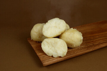 Potatoes on the cutting board, steam, warm potato, potatoes, group