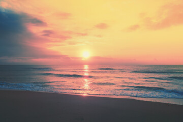 Naklejka na ściany i meble Seascape in the evening. Sunset over the sea with the beautiful blazing sky