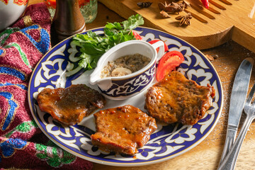 Beef medallions with tomatoes, herbs and mushroom sauce.