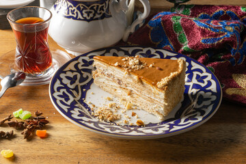 Dessert Honey cake. Classic cake made of honey cakes soaked in cream.