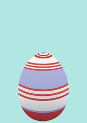 Decorated easter egg with copy space on blue background