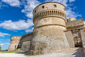 Fototapeta na wymiar View of the ancient Rocca di San Leo fortress on a sunny day and blue sky, Rimini, Italy