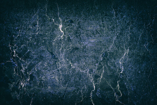 Beautiful dark blue texture of an old, cracked wall. Backgrounds.