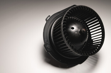 Heater motor. Spare part of car heating system on gray background