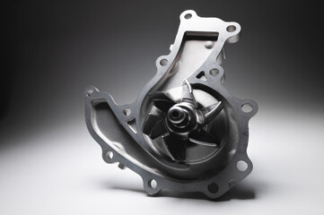 Water pump of the internal combustion engine cooling system. Contrasting on a gray gradient