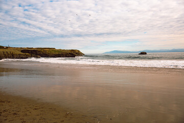The Pacific Ocean coast in the city of Monterey in California. United States of America. Beautiful beach on a sunny day. Ocean landscape.