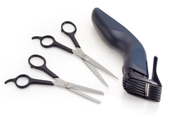 Electric hair clipper and two different hairdressers scissors