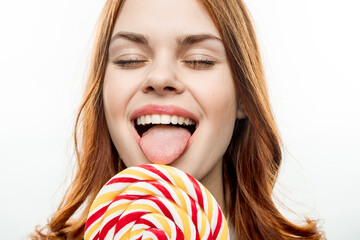 emotional woman with open mouth big multicolored lollipop 