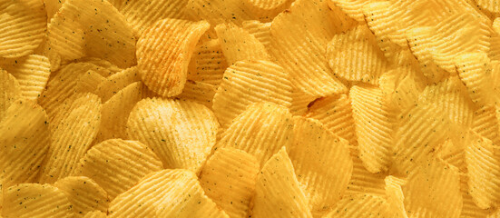 Food background of dry potato chips.
