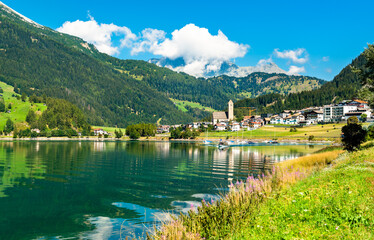 Fototapeta premium Reschen am See or Resia, a village on Lake Reschen in South Tyrol, Italian Alps