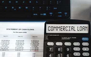 commercial loan - concept of text on calculator display. Top view