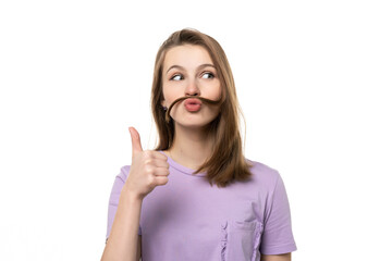 Portrait of funny girl showing thumb up, isolated on white background. Human emotions, gesture concept