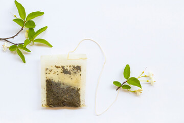 background texture tea bag green tea with leaf arrangement flat lay postcard style on white