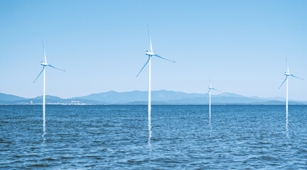 Wind power plants on the hills - green energy.