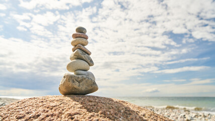 Fototapeta na wymiar High stack of stones in balance as a zen concept
