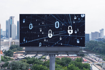 Padlock icon hologram on road billboard over panorama city view of Kuala Lumpur at day time to protect business, Malaysia, Asia. The concept of information security shields.