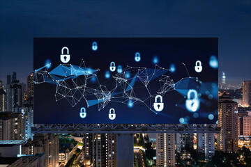 Fototapeta na wymiar Padlock icon hologram on road billboard over panorama city view of Kuala Lumpur at night to protect business, Malaysia, Asia. The concept of information security shields.