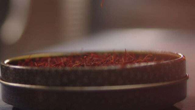 Chief taking saffron to cook some gastronomic food