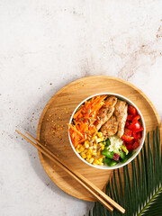 Healthy Vegan Poke bowl raw salad, heura vegetable protein, vegan chicken with variety vegetables,...