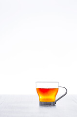 Cup with tea, lonely on white background and copy space, photography in vertical format