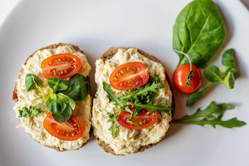 egg cheese ham dip, spread on open finger food sandwich with salad, tomato vegetables 