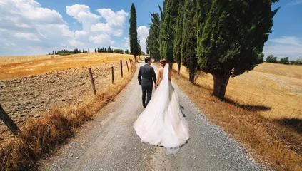 Fotobehang Toscane wedding couple happily goes their way  © Igor