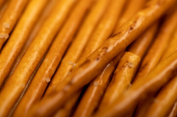 Salty bread strips spread out delicious snack surface texture.