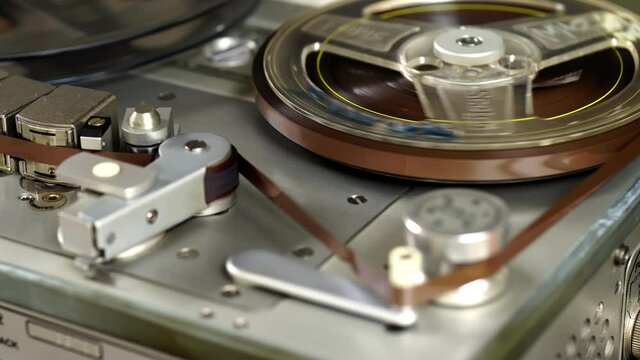 Old vintage reel-to-reel player. Tape recorder with spools. Bobbin tape recorder.	

