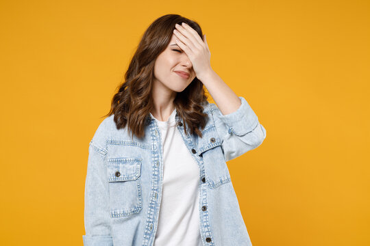 Young Mistaken Confused Disappointed Stressed Sad Woman 20s Wearing Stylish Casual Denim Shirt White T-shirt Put Hand On Face Facepalm Epic Fail Gesture Isolated On Yellow Background Studio Portrait