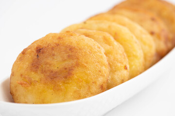 Authentic Aloo Tikki Also Known As Alu Ki Tikkia Is Seasoned Boiled Mashed Potato Cutlet Or Patties Used In Various Indian Street Food Masala Chaat Snacks. Isolated On White Background With Copy Space
