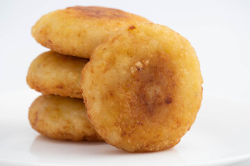 Delicious Aloo Tikki Also Known As Alu Ki Tikkia Is Seasoned Boiled Mashed Potato Cutlet Or Patties Used In Various Indian Street Food Masala Chaat Snacks. Isolated On White Background With Copy Space