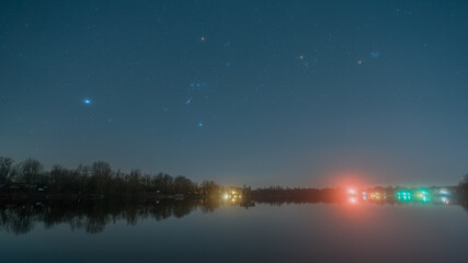 The Orion constellation over the quarry lake Kiefweiher near Ludwigshafen in Germany.