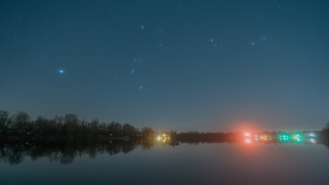 The Orion constellation over the quarry lake Kiefweiher near Ludwigshafen in Germany.