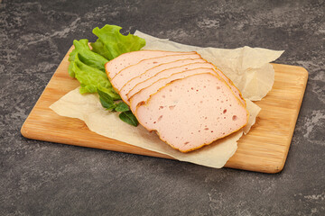 Boiled pork sausage over board
