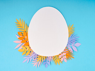Easter greeting card. Paper blank on blue background. Flat lay, top view, copy space.