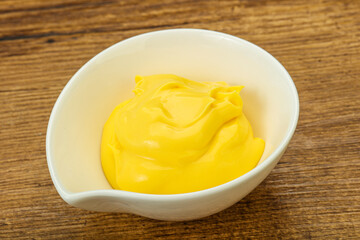 Natural cheese sauce in the bowl