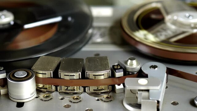Old vintage reel-to-reel player. Tape recorder with spools. Bobbin tape recorder.	
