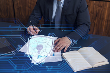 A businessman in formal wear signing the contract to prevent probability of risks in cyber...