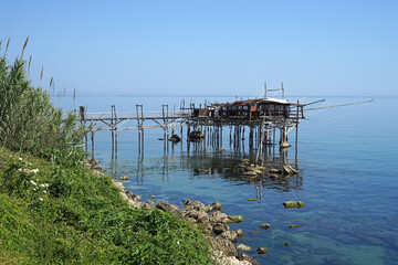 Fototapeta na wymiar Traditional trabucco, wooden fishing house on platform, Abruzzo, Italy, fishing or travel concept