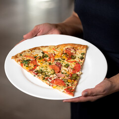 Super lunch. Large piece of pizza on plate in male hands. Delicious Pizza. Traditional italian food, top view. Nutrition dinner.