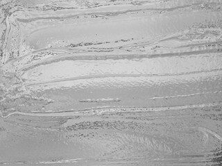 Winter artistic white marble texture. Ornate light gray pattern. Modern art of blur surface wall in cool black and white tones. Abstract paint of grunge festive backdrop great for invitation layout. 