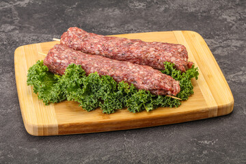 Raw minced beef kebab skewer