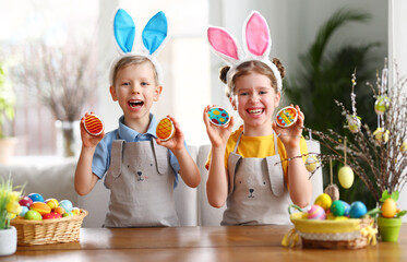 Cute kids with  Easter cookies at home