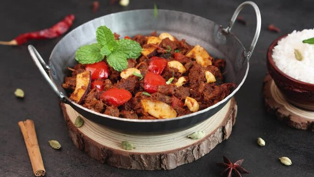  Mutton roast curry , meat beef roast curry 4K slow motion video footage Kerala India Sri Lanka Pakistan Chukhandar gosht spicy delicious traditional homemade with Indian spices coconut pieces cashew 