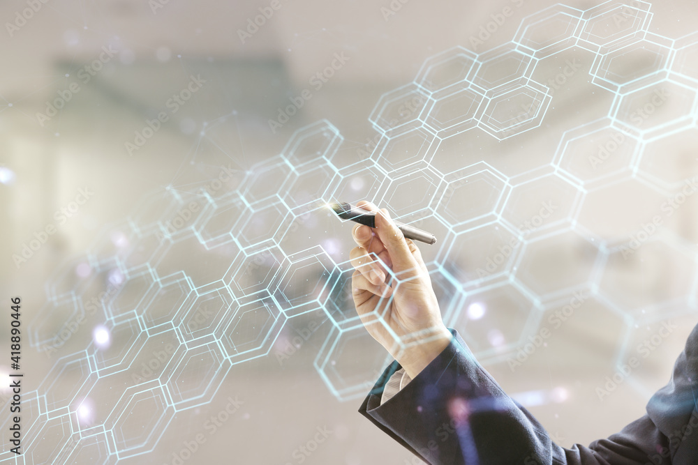 Poster man hand with pen draws abstract virtual wireless technology hologram with hexagon on blurred office